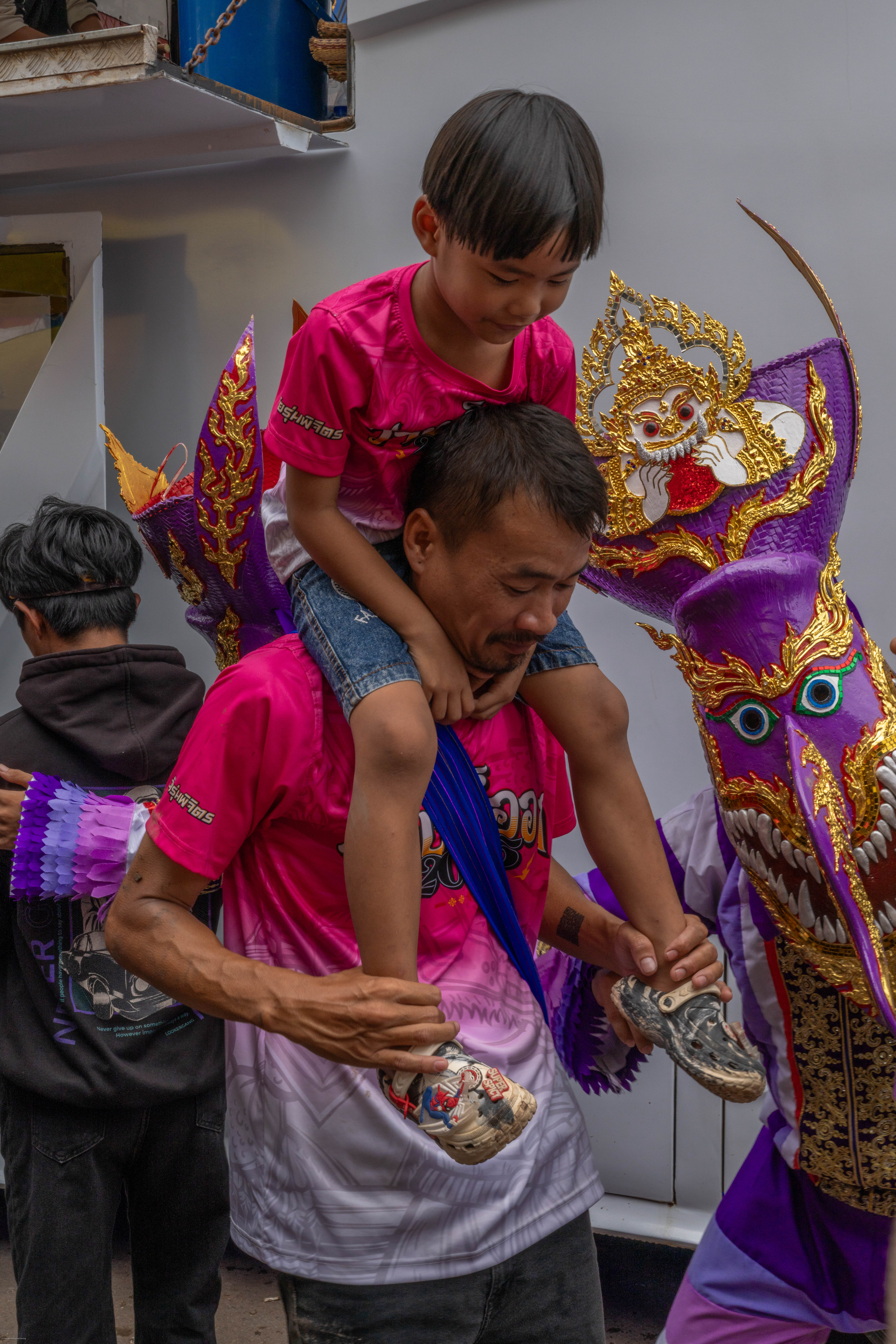 Father carrying son on his back 
